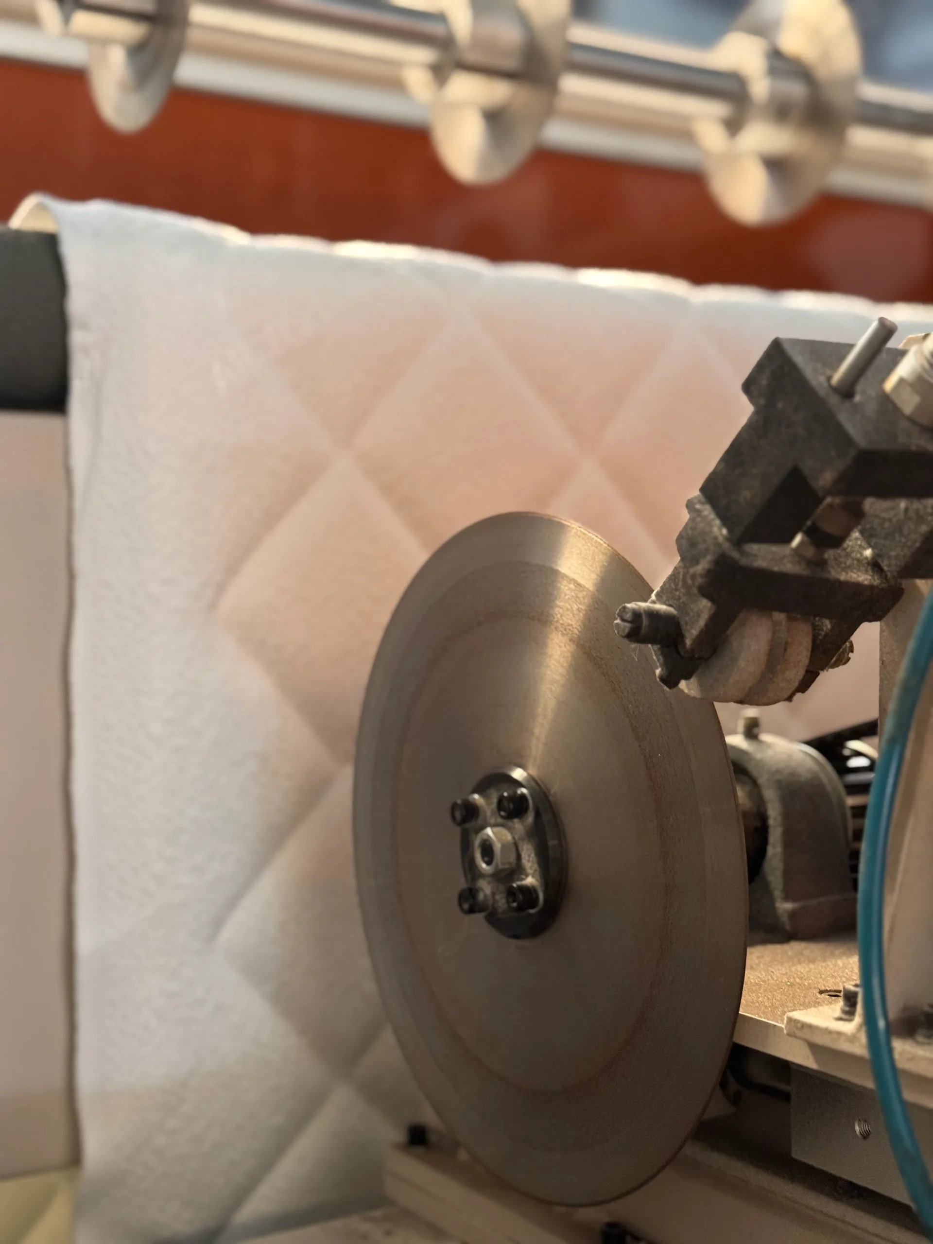 Ultrasonic bonding close-up — nonwoven insulator fabric being compacted